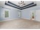 Light blue walls, ceiling fan, carpet, and en-suite bathroom access at 124 Streamwood Rd, Troutman, NC 28166