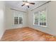 Bright bedroom with hardwood floors and two large windows at 124 Streamwood Rd, Troutman, NC 28166