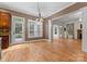 Bright dining area with hardwood floors and access to backyard at 124 Streamwood Rd, Troutman, NC 28166