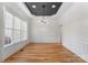 Formal dining room with hardwood floors, wainscoting, and chandelier at 124 Streamwood Rd, Troutman, NC 28166