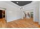 Formal dining room with hardwood floors, wainscoting, and view of staircase at 124 Streamwood Rd, Troutman, NC 28166