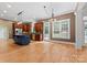 Spacious kitchen with island, stainless steel appliances, and hardwood floors at 124 Streamwood Rd, Troutman, NC 28166