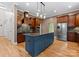 Modern kitchen with stainless steel appliances, granite countertops, and dark wood cabinets at 124 Streamwood Rd, Troutman, NC 28166