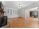 Living room with hardwood floors, built-in shelves, and fireplace at 124 Streamwood Rd, Troutman, NC 28166