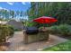 Outdoor kitchen with built-in grill and refrigerator at 124 Streamwood Rd, Troutman, NC 28166