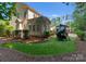Landscaped side yard with artificial turf and playset at 124 Streamwood Rd, Troutman, NC 28166