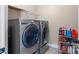 Laundry room with washer, dryer, and shelving at 5601 Ballenger Ct, Waxhaw, NC 28173
