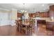 Kitchen dining area with hardwood floors, a table, and chairs, near the kitchen at 5601 Ballenger Ct, Waxhaw, NC 28173