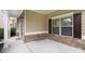 Charming front porch with stone detailing and a small bench at 5601 Ballenger Ct, Waxhaw, NC 28173