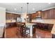 Spacious kitchen featuring an island, stainless steel appliances, and rich wood cabinetry at 5601 Ballenger Ct, Waxhaw, NC 28173