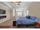 Spacious main bedroom with large windows and a ceiling fan at 5601 Ballenger Ct, Waxhaw, NC 28173