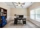 Home office with built-in shelving, desk, and large window at 5601 Ballenger Ct, Waxhaw, NC 28173