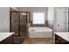 Bathroom features a large soaking tub, shower, and updated fixtures at 5601 Ballenger Ct, Waxhaw, NC 28173