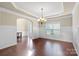 Formal dining room with hardwood floors, crown molding, and a chandelier at 5601 Ballenger Ct, Waxhaw, NC 28173