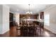 Kitchen dining area with dark wood table and chairs and hardwood floors at 5601 Ballenger Ct, Waxhaw, NC 28173