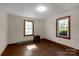 Bedroom with hardwood floors and two windows at 2017 And 2025 Filbert Hwy, York, SC 29745