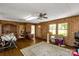 Living room with wood walls, hardwood floors, and views to the kitchen at 2017 And 2025 Filbert Hwy, York, SC 29745