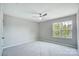 Well-lit bedroom with ceiling fan and window at 14303 Evening Flight Ln, Charlotte, NC 28262