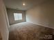 Spacious bedroom with neutral carpeting and large window at 2761 Ruby Mill Dr, Gastonia, NC 28056