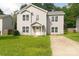 Two-story house with gray siding and a grassy lawn at 830 Oakshire Cir, Charlotte, NC 28214
