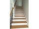 Oak staircase with black metal railing at 830 Oakshire Cir, Charlotte, NC 28214