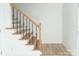 Wooden staircase with black metal balusters at 830 Oakshire Cir, Charlotte, NC 28214