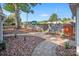 Landscaped pathway with stone retaining walls and wooden gate at 50444 Haven Bend Rd, Albemarle, NC 28001