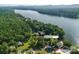 Aerial view of waterfront home with beautiful surroundings at 50444 Haven Bend Rd, Albemarle, NC 28001