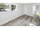 Spacious bedroom with lake view and wood-look floors at 50444 Haven Bend Rd, Albemarle, NC 28001