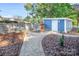 Landscaped side yard with stone wall and shed at 50444 Haven Bend Rd, Albemarle, NC 28001
