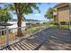 Lakefront deck with composite decking and white railing at 50444 Haven Bend Rd, Albemarle, NC 28001