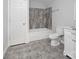 Bathroom with tub, shower, and gray tile flooring at 50444 Haven Bend Rd, Albemarle, NC 28001