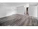 Spacious finished basement with vinyl plank flooring and access to other rooms at 50444 Haven Bend Rd, Albemarle, NC 28001