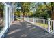 Lakefront deck with composite decking and white railing at 50444 Haven Bend Rd, Albemarle, NC 28001