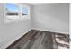 Well-lit bedroom with lake view and wood-look floors at 50444 Haven Bend Rd, Albemarle, NC 28001