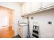 Laundry room with cabinets and utility sink at 6331 Dwayne Starnes Dr, Hickory, NC 28602