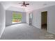 Spacious bedroom with large window, carpet, and walk-in closet at 5617 Davis Ridge Dr, Charlotte, NC 28269