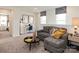 Loft area with a gray sectional sofa and a workspace at 161 Shepherds Landing Dr, Mooresville, NC 28115