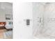 Spa-like bathroom with marble shower, modern fixtures and a view of the bedroom at 323 Atherton St, Charlotte, NC 28203
