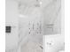 Large walk-in shower with marble tile and multiple shower heads at 323 Atherton St, Charlotte, NC 28203