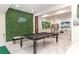 Finished basement with pool table, green wall, and bar area at 323 Atherton St, Charlotte, NC 28203