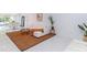 Living room with white sectional sofa, tiger print rug, and marble floors at 323 Atherton St, Charlotte, NC 28203
