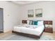 Bright main bedroom with a floating bed and wood nightstands at 323 Atherton St, Charlotte, NC 28203