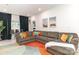 Finished basement with sectional sofa, large windows, and stylish rug at 323 Atherton St, Charlotte, NC 28203