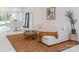 Living room with white sectional sofa, tiger print rug, and marble floors at 323 Atherton St, Charlotte, NC 28203