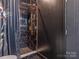 Contemporary shower with black marble tile and gold fixtures at 323 Atherton St, Charlotte, NC 28203