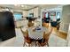 Bright kitchen with white cabinets, granite countertops, and a dining area at 836 S Cherry Rd, Rock Hill, SC 29732