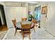Kitchen features white cabinets and a round dining table at 836 S Cherry Rd, Rock Hill, SC 29732