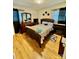Spacious bedroom with hardwood floors and a large bed at 836 S Cherry Rd, Rock Hill, SC 29732
