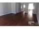Spacious living room with hardwood floors at 7118 Quail Meadow Ln, Charlotte, NC 28210